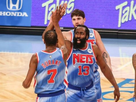 James Harden and Kevin Durant celebrate during his Brooklyn Nets debut